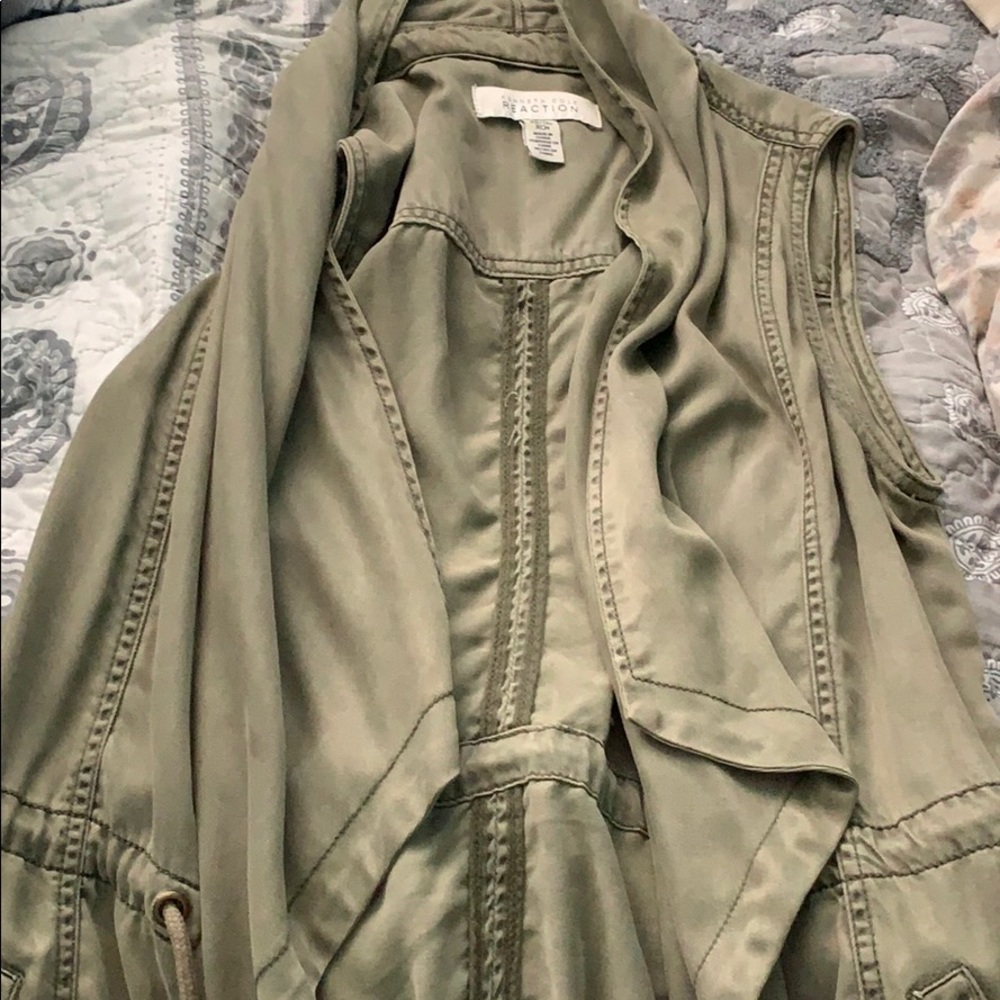 green vest with sowed in pockets.